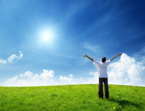 field of grass and happy young man